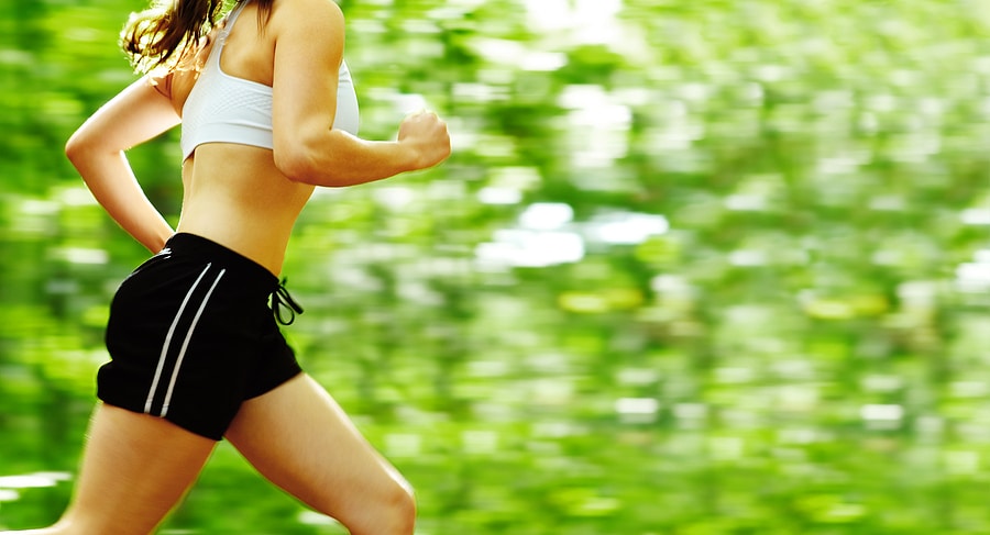 Athletic woman holds Active Iron High Potency